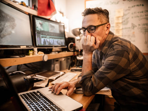 istock Male video editor working at home 1287487684