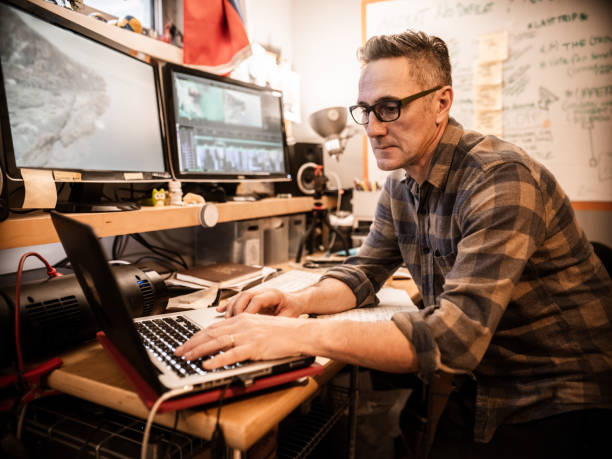 istock Male video editor working at home 1287487734