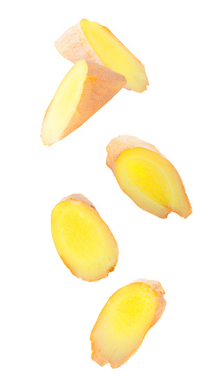Isolated flying fruit. Five pieces of falling ginger root on white background with clipping path as package design element and advertising. Full depth of field.
