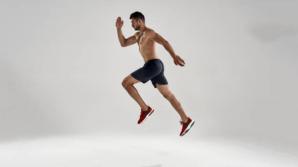 istock Young handsome caucasian professional male runner jumping 1287487786