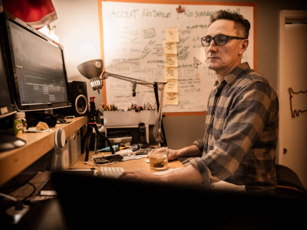 istock Male video editor working at home 1287487878