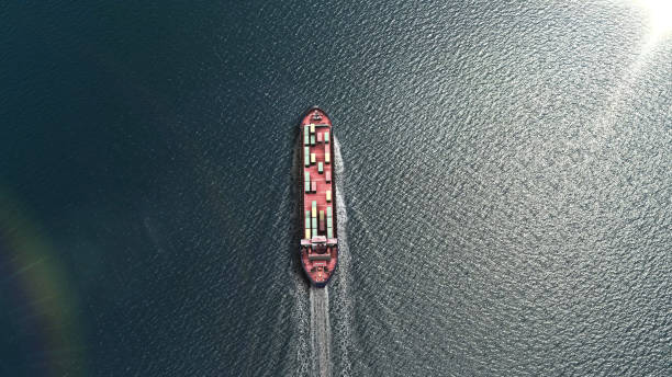 istock Aerial top view of cargo ship carrying containers 1287489617