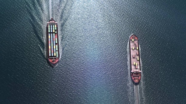istock Two cargo ships sailing close, one to dock and one to leave Harbor 1287489807