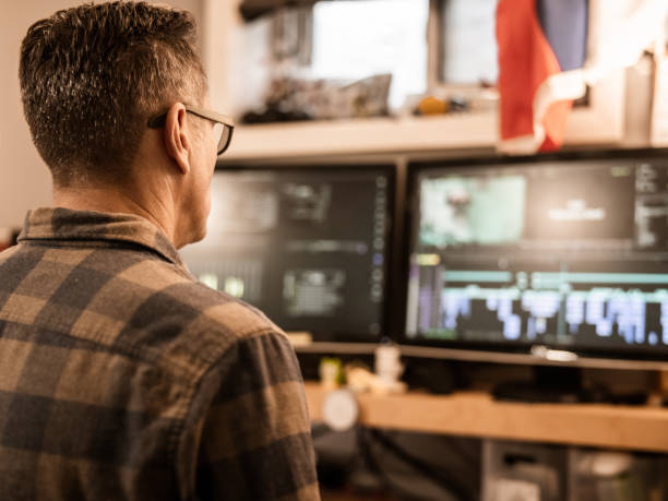 istock Male video editor working at home 1287490202