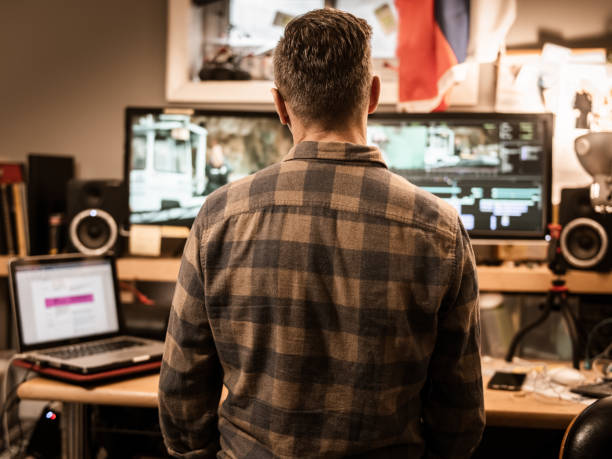 istock Male video editor working at home 1287490362
