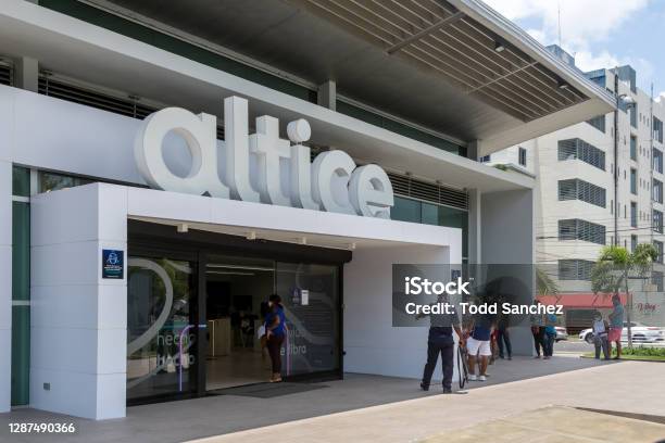 People In Line To Pay Phone Bill At Altice Phone Company In Capital Of Dominican Republic Stock Photo - Download Image Now