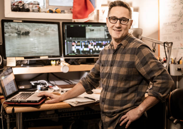istock Male video editor working at home 1287491031