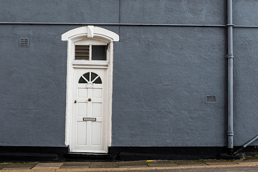 Shot of a closed white front entrance door.