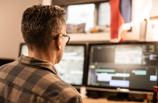 istock Male video editor working at home 1287491789