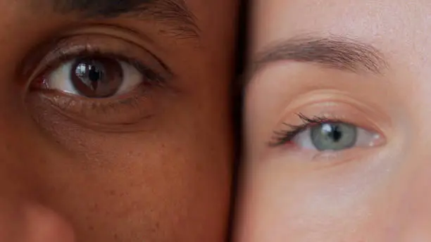 Black man and white woman's eyes.Interracial race love concept. Anti-racism