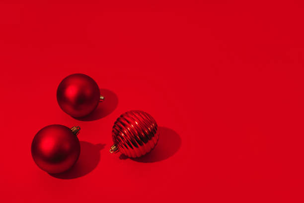istock Christmas and New Year red balls with copy space on red backdrop. 1287493667