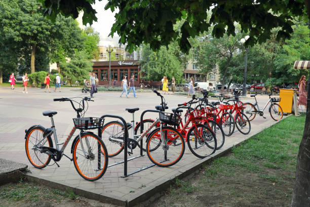 Parking lot for rental bicycles on Pushkinskaya street Rostov-on-Don, Russia - August 20, 2020: Parking lot for rental bicycles on Pushkinskaya street in the pedestrian area on summer day rostov on don stock pictures, royalty-free photos & images
