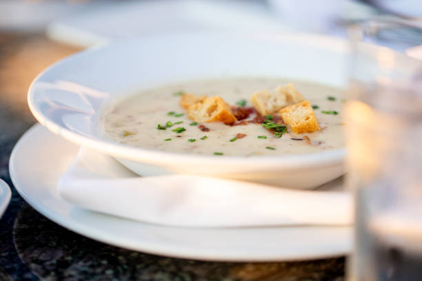 Fine Dining Restaurant Food Clam Chowder High end Restaurant Food Clam Chowder Patio Late evening Sunlight Chowder stock pictures, royalty-free photos & images