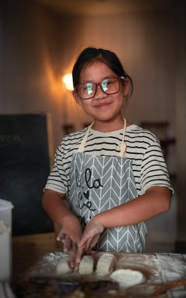 istock Portrait of girl during making bakery 1287499886