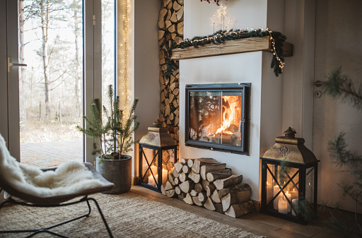 Cozy living room winter interior with fireplace.
