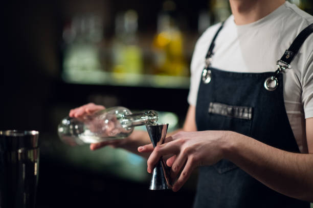 istock An experienced bartender prepares an alcoholic cocktail. No face, close-up, copy space 1287503328