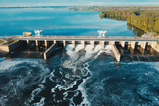 istock Hydroelectric dam with flowing water through gate, aerial view from drone 1287504122