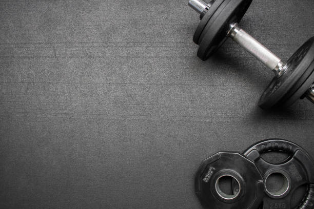 fitness equipment on the floor at the gym - gym imagens e fotografias de stock