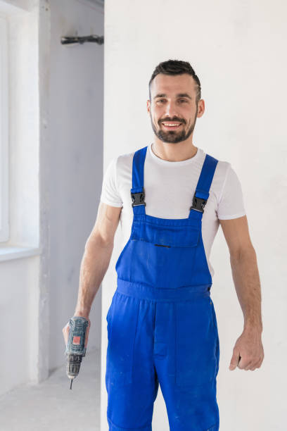 istock The foreman holds a drill in his hand 1287505213