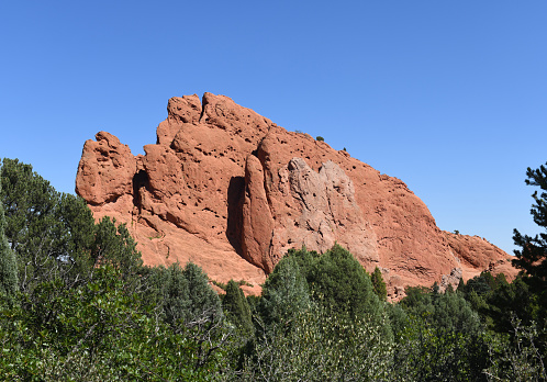 The Garden of the Gods’ rock formations are the Mesosoic, sedimentary strata of red, pink and white sandstone, conglomerates and limestone that were deposited horizontally, but have been tilted vertically by the uplift of the Rocky Mountains. Garden of the Gods today is a public park designated a National Natural Landmark.