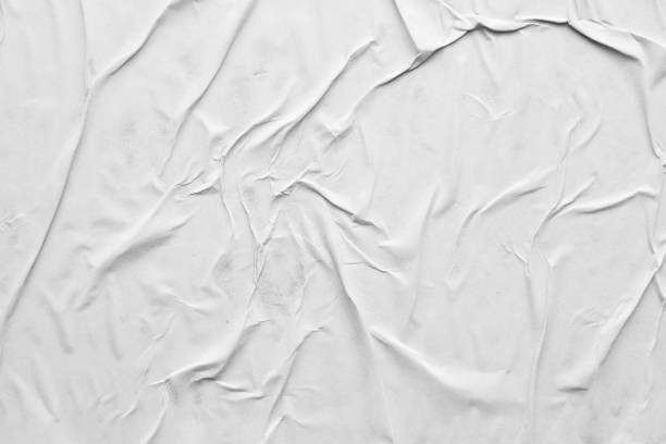 istock Blank white crumpled and creased paper poster texture background 1287510175