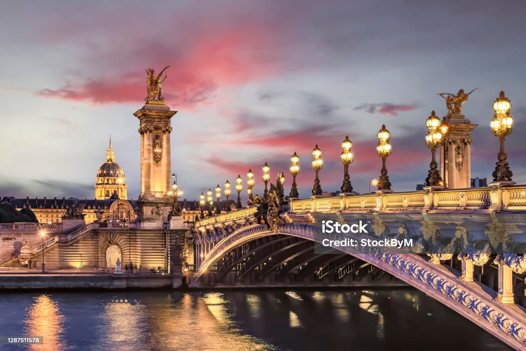 Architecture in Paris Alexandre III bridge in Paris at sunset Paris - France Stock Photo