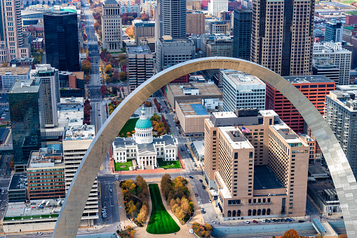 The Gateway to the West Arch and the downtown area of St. Louis, Missouri along the banks of the mighty Mississippi River shot from an altitude of about 700 feet over the river.
