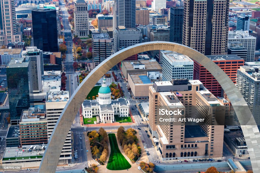 Downtown St. Louis Beyond the Arch The Gateway to the West Arch and the downtown area of St. Louis, Missouri along the banks of the mighty Mississippi River shot from an altitude of about 700 feet over the river. St. Louis - Missouri Stock Photo