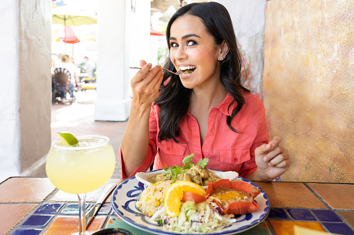 Pretty Hispanic Women Eating Out