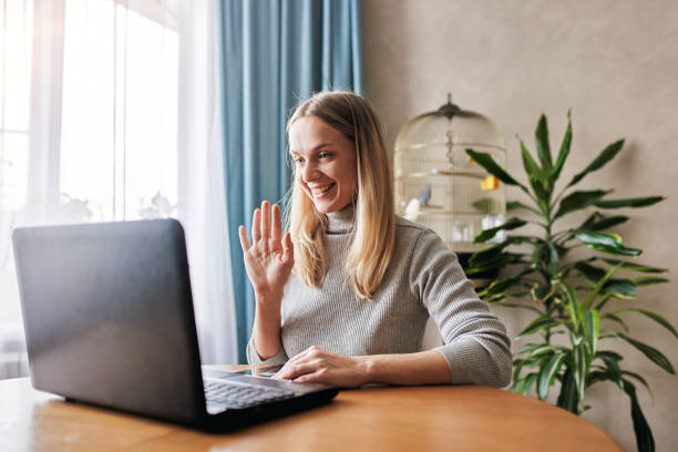istock Attractive happy young woman studying at the home 1287514880