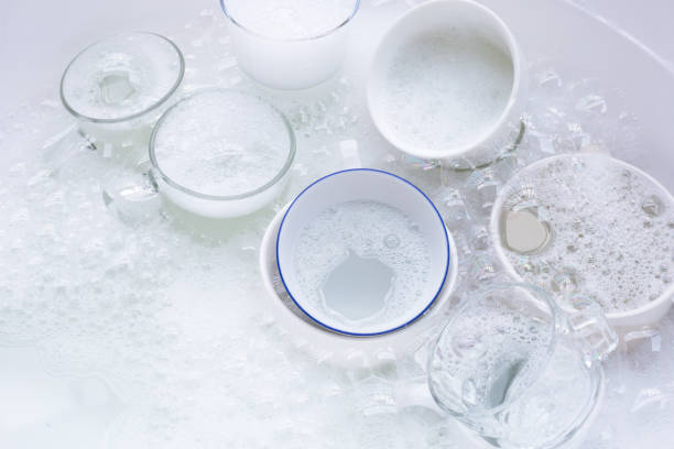 istock Washing used drinking glasses and cups 1287515571