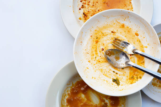 istock Dirty dishes on white background. Top view 1287518328