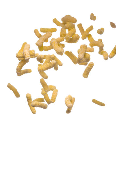 istock Plenty of Flying Popcorn Flakes isolated Over White Background. Vertical image Orientation 1287520939