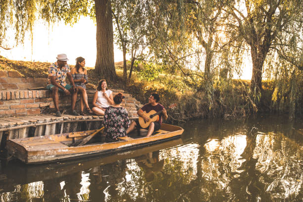 istock Musical afternoon with friends by the lake 1287521303
