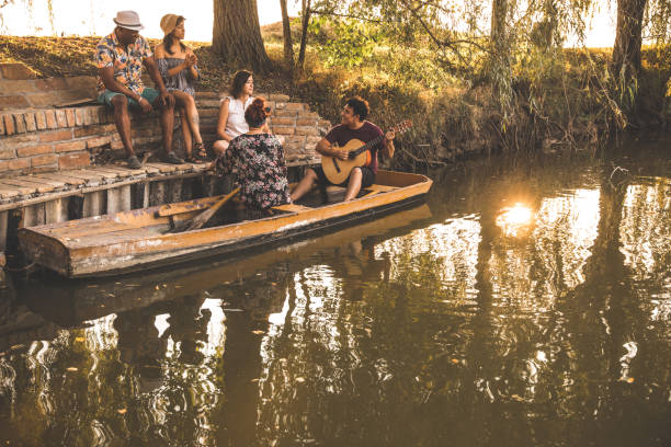 istock Lovely spring afternoon with friends by the lake 1287521327