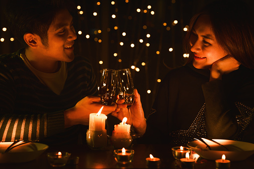 asian lovers couple having romantic moment celebrating wedding anniversary together at dinner. concept of lovers couple relationship on wedding anniversary