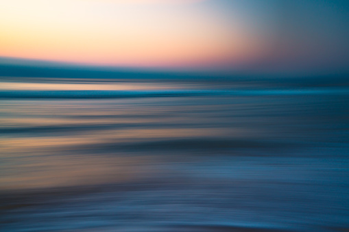 Before sunrise abstract seascape background in soft blur light pink, yellow, blue, and cyan colors