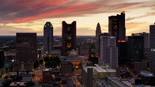 Fiery Sunset Behind Downtown Columbus - Drone Aerial shot of Downtown Columbus after sunset, including the Ohio Statehouse. ohio ohio statehouse columbus state capitol building stock pictures, royalty-free photos & images