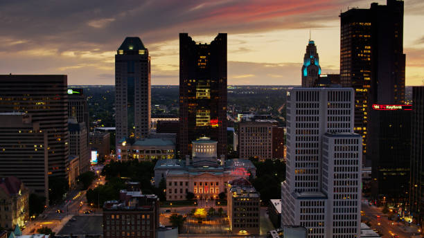 Ohio Statehouse in Downtown Columbus Lit Up at Twilight Aerial shot of Downtown Columbus after sunset, including the Ohio Statehouse. ohio ohio statehouse columbus state capitol building stock pictures, royalty-free photos & images