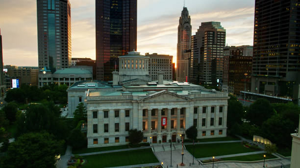 Aerial Shot of Ohio Statehouse at Dusk Aerial establishing shot of the Ohio Statehouse in Columbus at sunset. ohio ohio statehouse columbus state capitol building stock pictures, royalty-free photos & images