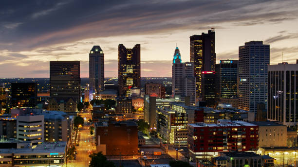 Aerial View of Downtown Columbus Illuminated at Twilight Aerial shot of Downtown Columbus after sunset, including the Ohio Statehouse. ohio ohio statehouse columbus state capitol building stock pictures, royalty-free photos & images