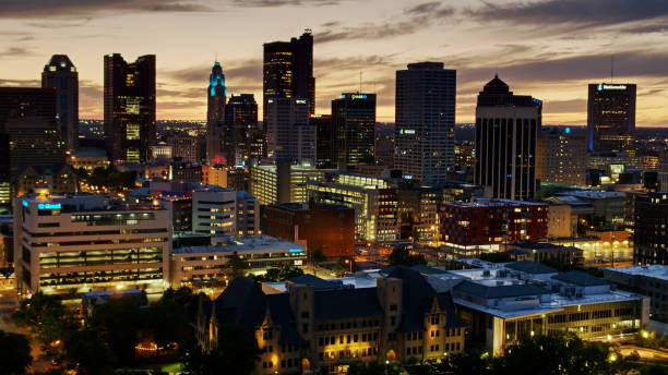 Aerial View of Downtown Columbus Lit Up at Dusk Aerial shot of Downtown Columbus after sunset, including the Ohio Statehouse. ohio ohio statehouse columbus state capitol building stock pictures, royalty-free photos & images