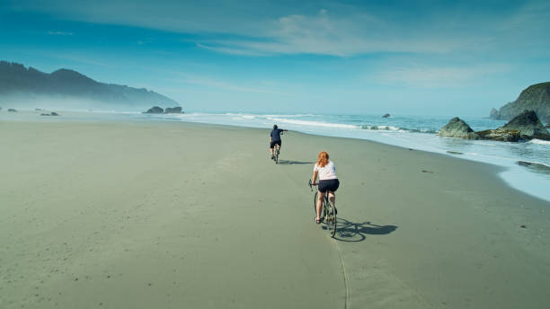 istock Cyclists on Hazy Beach in Oregon - Aerial 1287527097