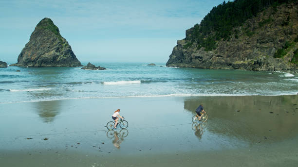 istock Drone Shot Alongside Cyclists on Whaleshead Beach 1287527116