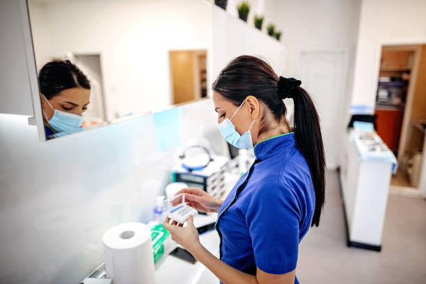 istock Dental nurse preparing medicine for surgery 1287527850