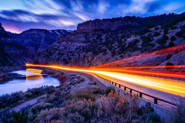 Glenwood Canyon Interstate 70 Colorado at Night - Time exposure of automobiles moving through going eastbound and westbound.