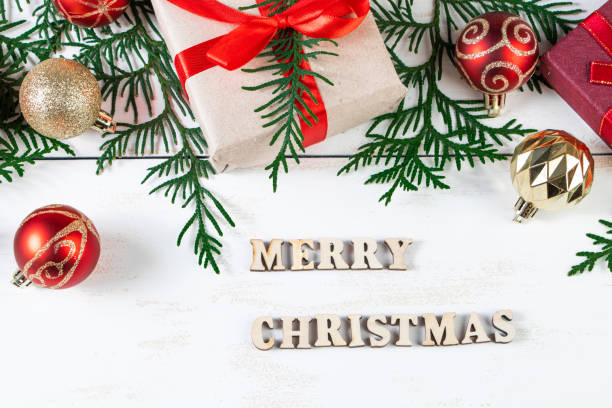 istock Merry Christmas concept. Gift boxes and festive decor on white background. 1287529915