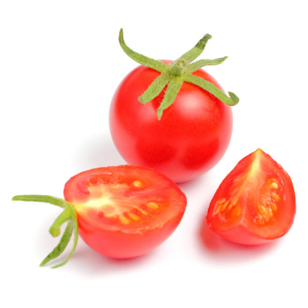 istock Cherry tomatoes with greens branches on a white background close-up, place for text, isolate 1287530881