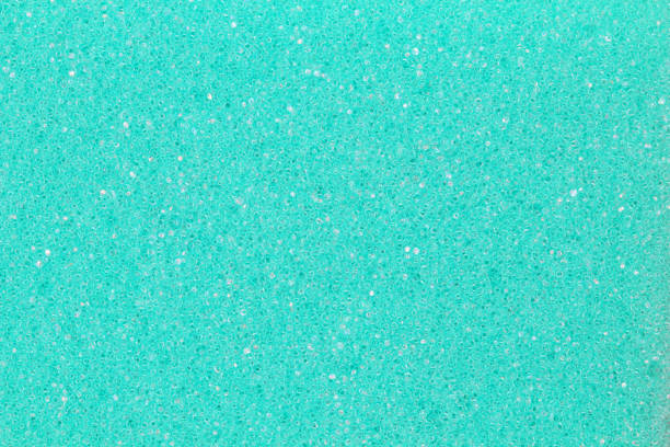 istock Foamed surface, as a background, emerald color, close-up. Flat lay, top view, copy space. 1287530921