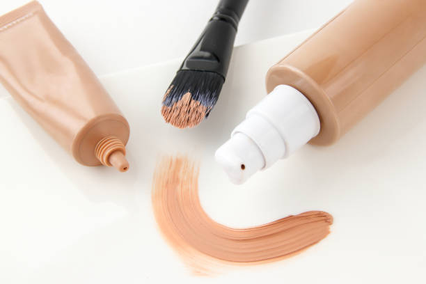 istock Bottles of foundation and strokes with make-up brushes 1287534495